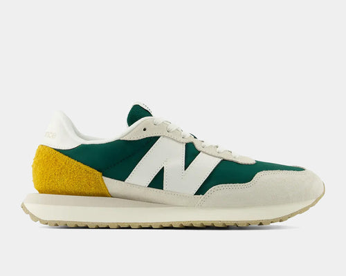 New Balance 237 V1 sneakers in green, white, and yellow with suede overlays and retro-inspired design, side view.