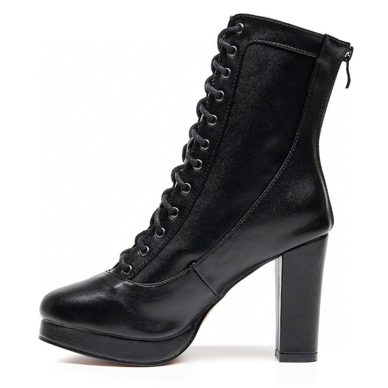 The Aadijay boot by Bailaqui, crafted in black vegan leather, features a street sole, side zipper, and adjustable laces for a perfect fit against a white backdrop.