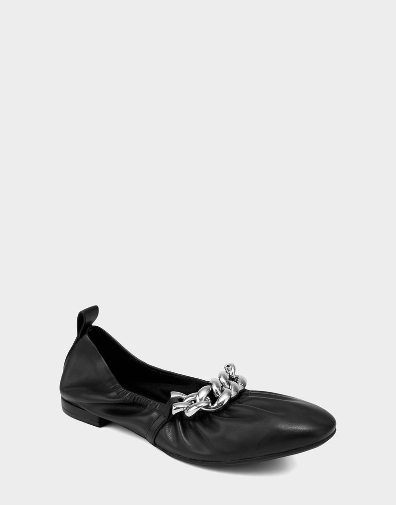 Comfortable Women's Dress Flat in Black Faux Leather Side Angle View