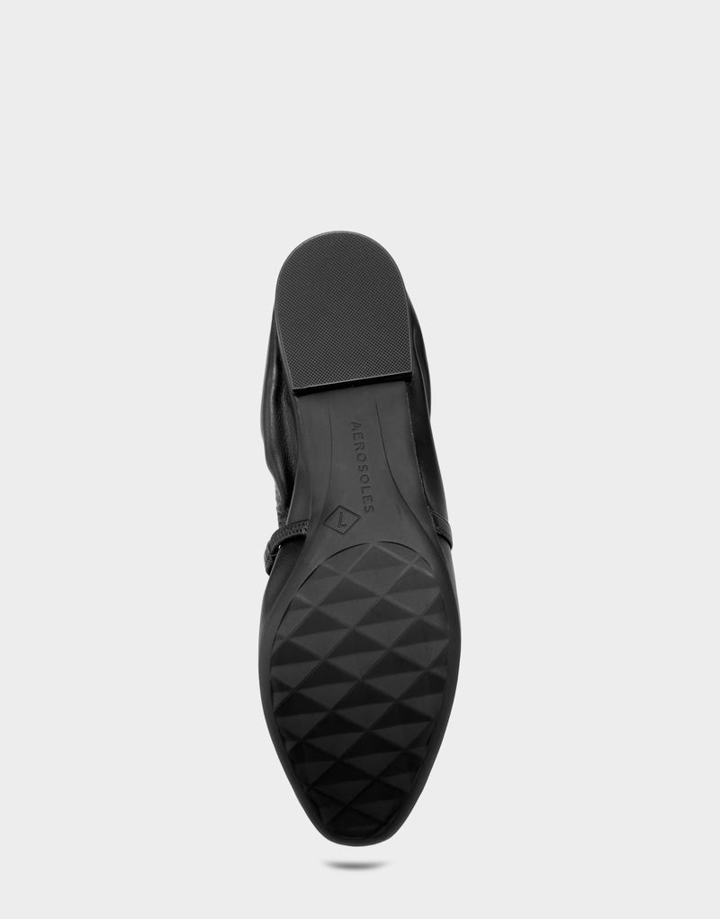Comfortable Women's Dress Flat in Black Faux Leather Bottom View