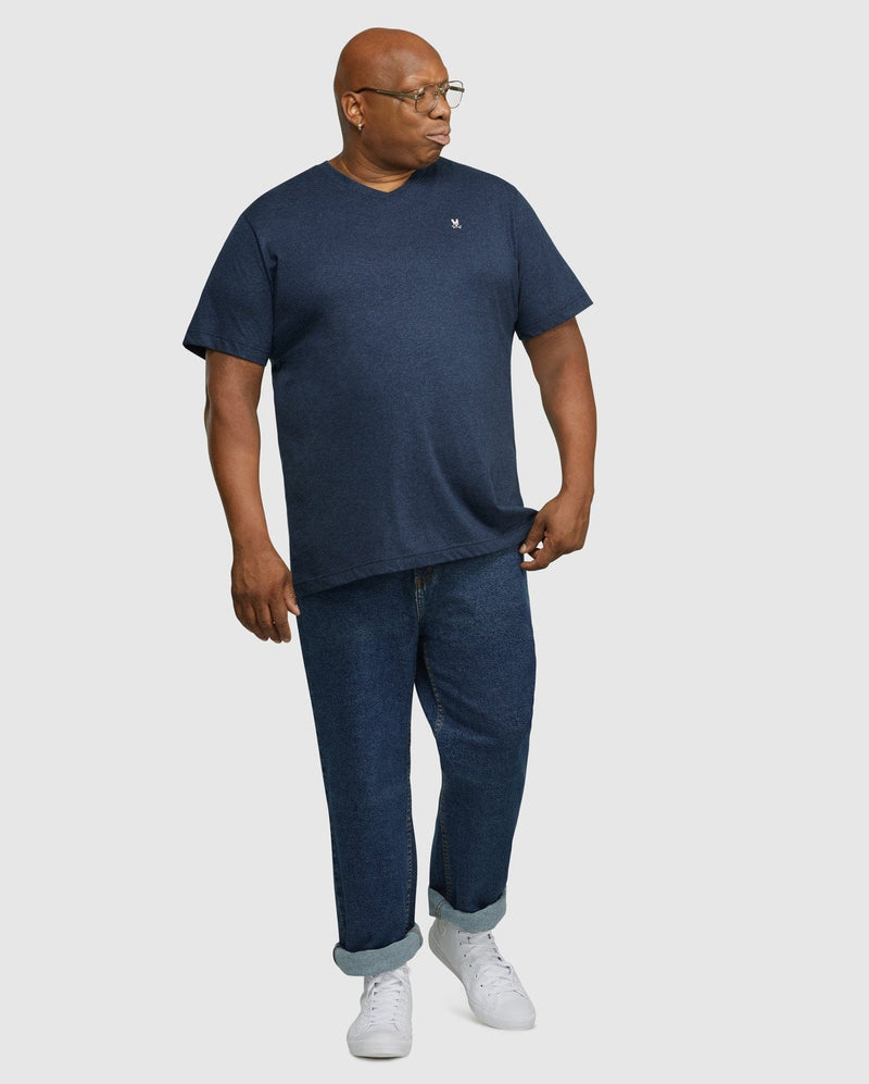 Psycho Bunny Big and Tall Classic V Neck Tee in navy, featuring short sleeves and embroidered logo detail, lifestyle view.