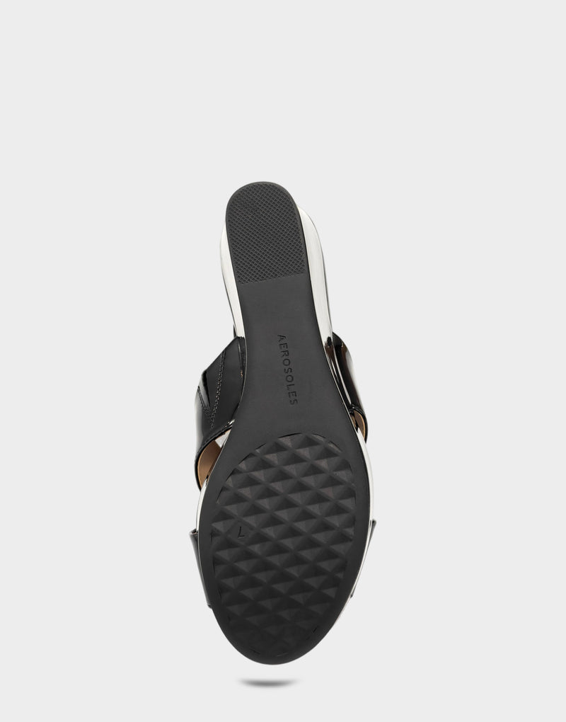 Comfortable Women's Wedge Sandal in Black Faux Patent Bottom View