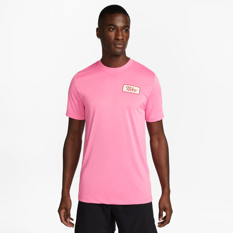 Nike Dri-FIT Fitness T-Shirt in bright pink with a classic Nike logo on the chest, front view.