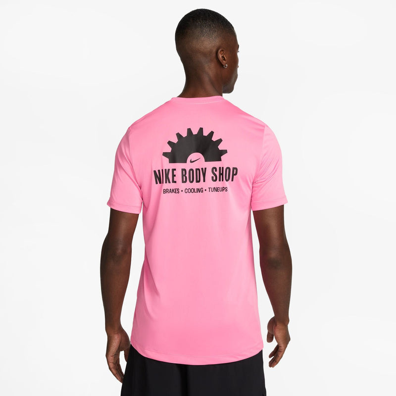 Nike Dri-FIT Fitness T-Shirt in vibrant pink with bold "Nike Body Shop" graphic on back, rear view.