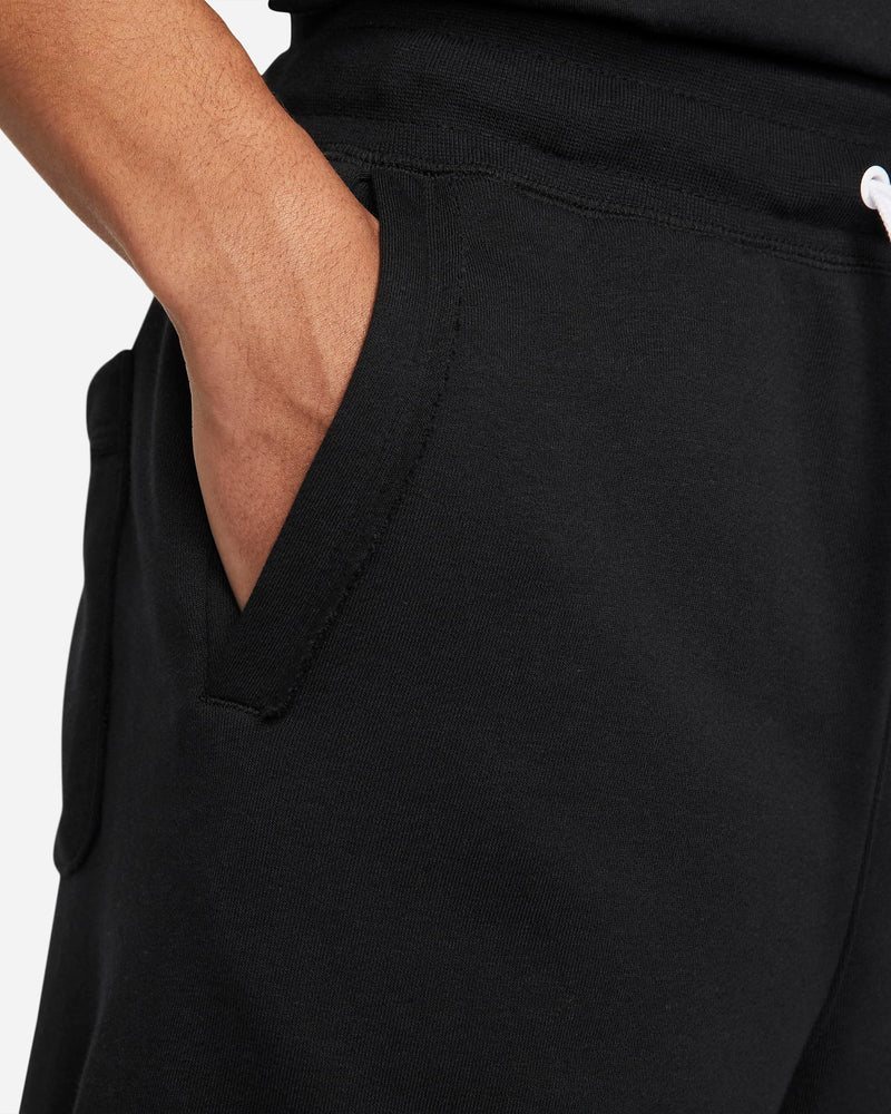 Nike French Terry Alumni Shorts in black, featuring soft fabric and side pockets, close-up view of pocket detail.