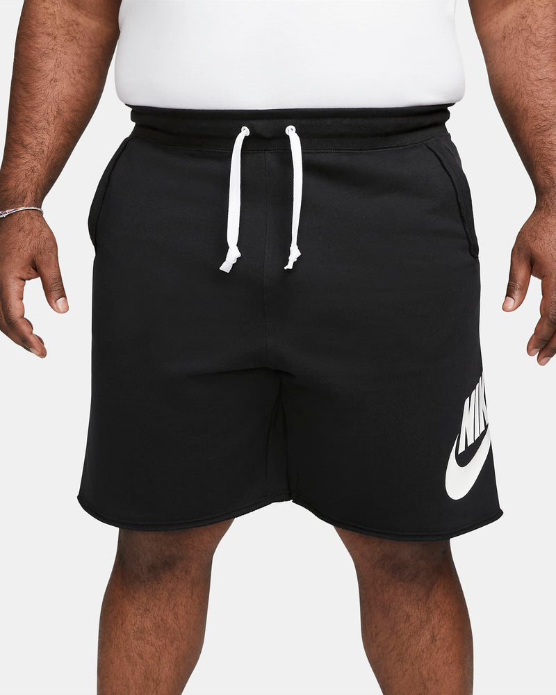 Nike French Terry Alumni Shorts in black with white drawstrings and bold Nike logo on the leg, front view.